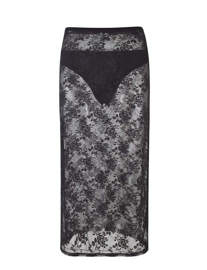 The MIRABEL SKIRT - BLACK from TIGERMIST is a high-waisted lace pencil skirt that boasts a sheer floral pattern overlay. It features a solid black waistband and an eye-catching inner lining in a V-shape that tapers towards the hem, with an elegant hemline falling just below the knee.