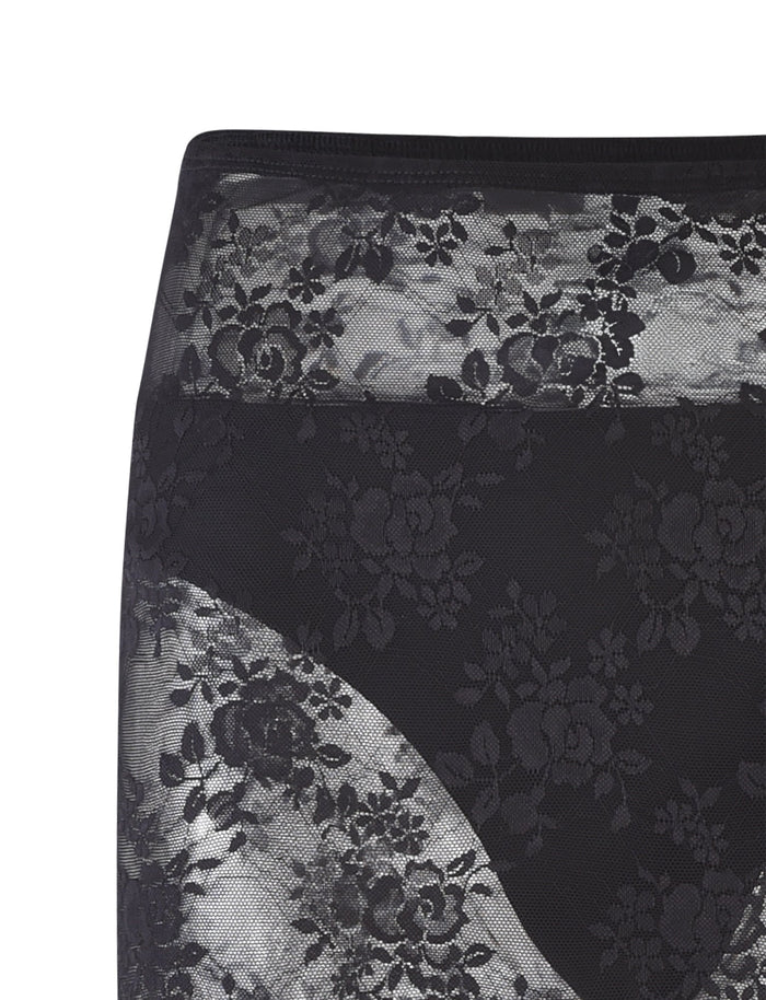 Close-up of the MIRABEL SKIRT - BLACK from TIGERMIST featuring black lace with a floral pattern. The image showcases elaborate flower designs intricately woven through the lace, creating an elegant and delicate texture. The sheer background of the fabric highlights the floral arrangements beautifully.