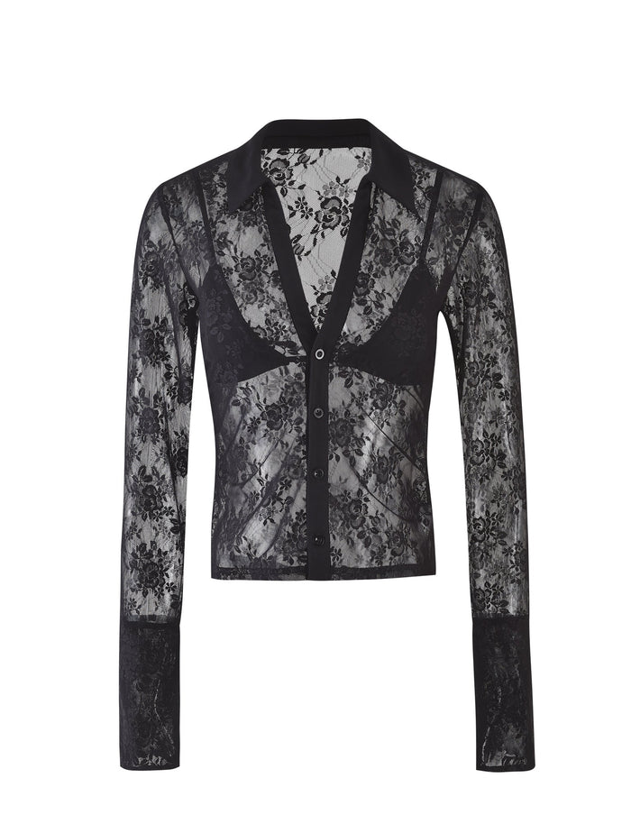 The MIRABEL TOP - BLACK : LACE from TIGERMIST is a long-sleeve lace blouse adorned with a floral pattern. It features a deep V-neckline, a pointed collar, and a front button closure. The semi-sheer material gives it an elegant and stylish appearance.