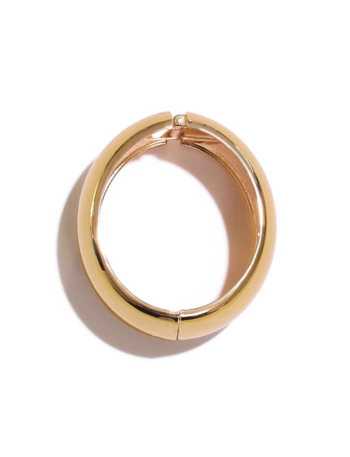 A gold hoop earring with a smooth, polished surface is displayed closed on a white background. Pair it with the TIGERMIST MIRAH CHUNKY BANGLE - GOLD for an effortlessly stylish look.