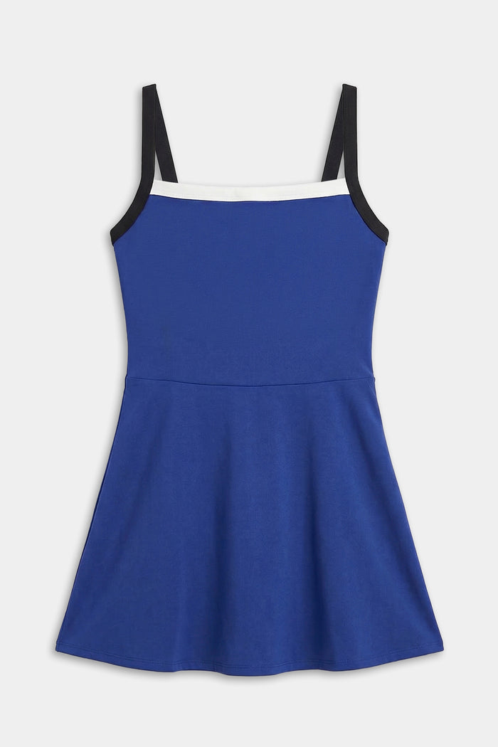 The SPLITS59 Monah Rigor Dress in cobalt and black features a sleeveless design, black shoulder straps, and a white neckline trim, shown flat on a white background.