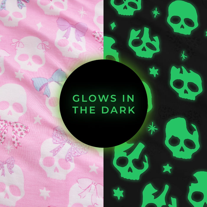 "Glows in the Dark" graphic highlighting the Ms. Kelly print's glow-in-the-dark skull details, black background