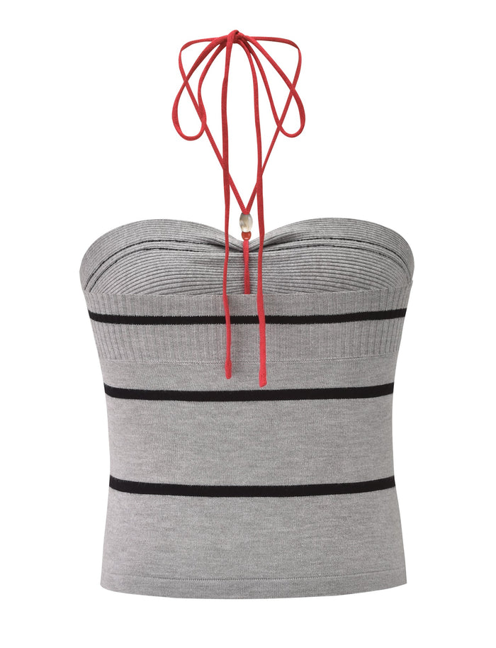 The NOUR TOP - GREY STRIPE by TIGERMIST is a fitted knit halter top with grey and black horizontal stripes, a red halter neck tie, and a chic strapless design.