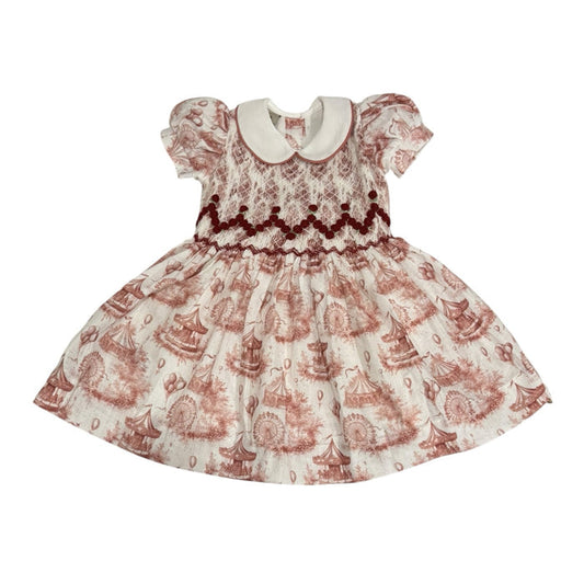 Ollie Circus Carousel Toile Burgundy Handsmocked Girl Dress in burgundy carousel print