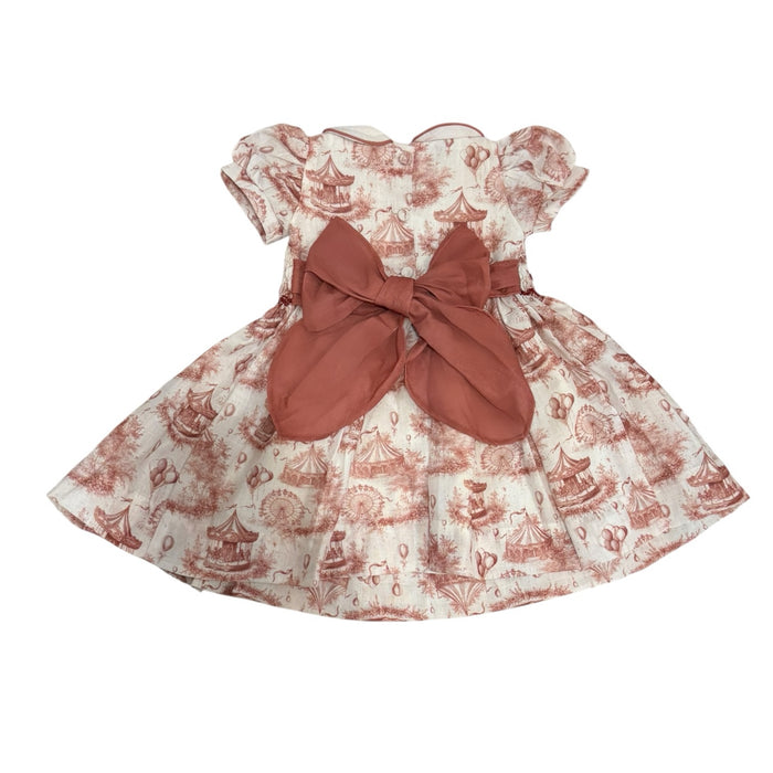 Back view of Ollie Circus Carousel Toile Dress with oversized burgundy bow