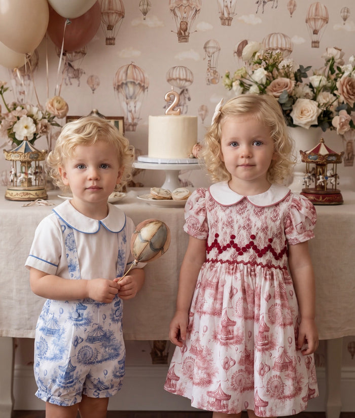 Children wearing coordinating Ollie Circus Carousel outfits