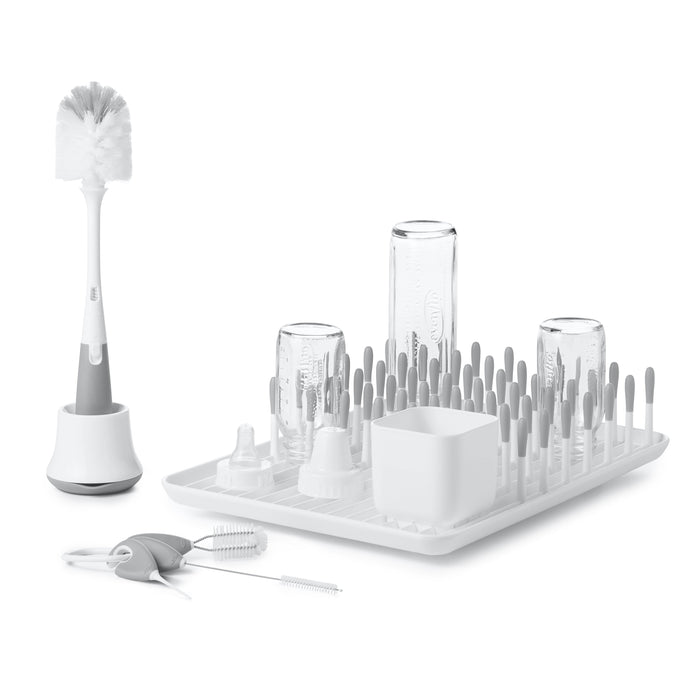 Baby bottle drying rack with accessories from Oxo Tot Bottle & Cup Cleaning Set in grey