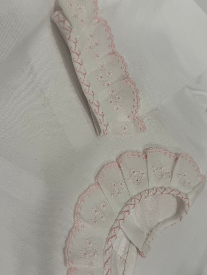 Close-up of pink embroidered ruffle detailing on Paola Shirt