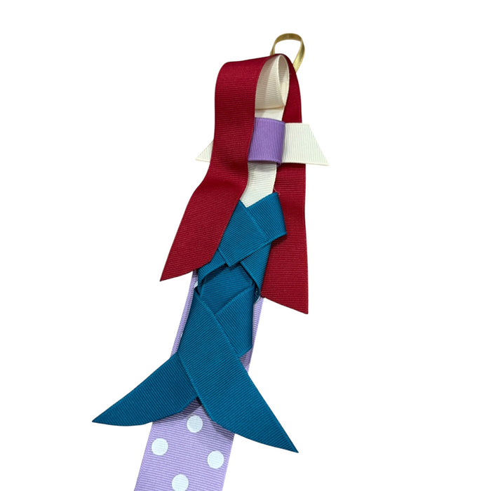 Close-up of princess bow clips attached to coordinating ribbon hanger