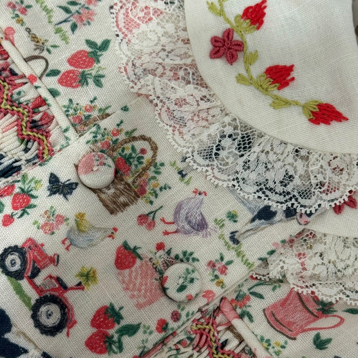Close-up of soft countryside floral print on Renata Handsmocked Dress
