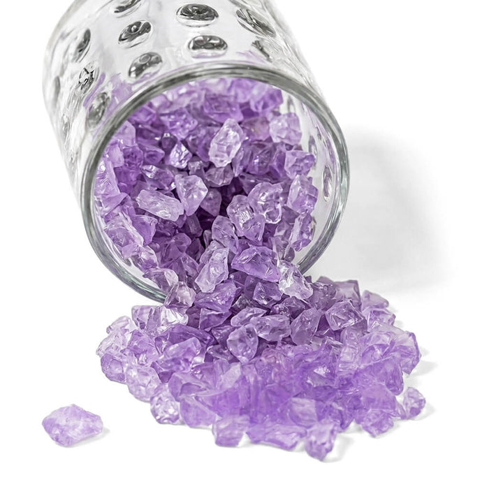 Purple Glass Pebble Vase Filler pouring from a glass vase