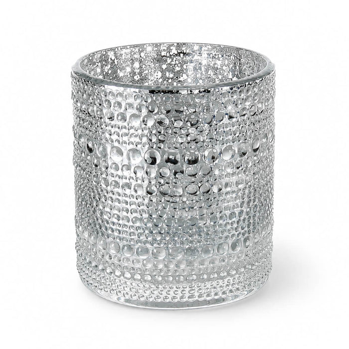 Pearly silver candle holder with textured bubble design on white background