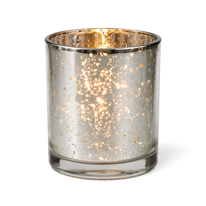 Silver mercury glass candle holder glowing on white background