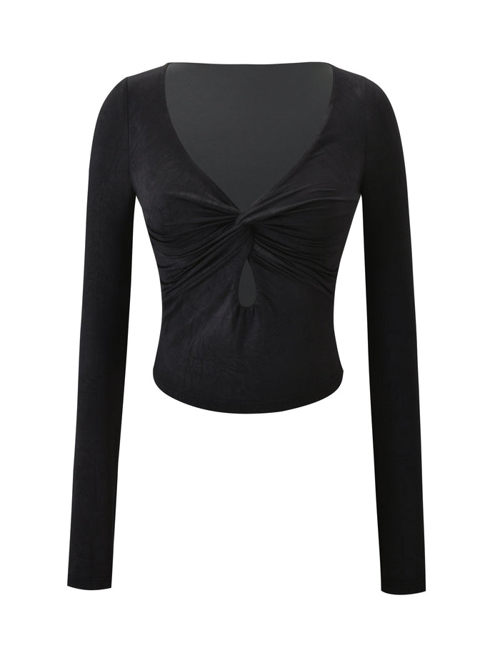 The SAFFIRA LONG SLEEVE TOP - BLACK by TIGERMIST is a fitted crop with a low-cut V neckline, twist knot front, and keyhole detail, creating a stylish look against a white background.