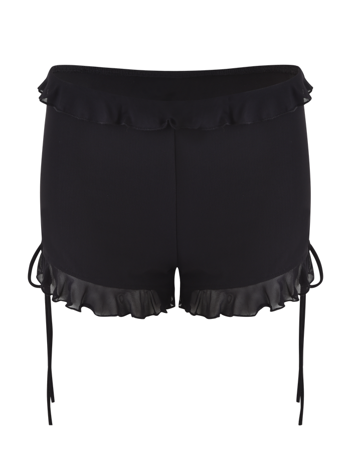The SIERA SHORT - BLACK by TIGERMIST features a bodycon fit, satin-like finish, short hemline, decorative ruffles at the waistband and leg openings, and thin ribbon side ties.