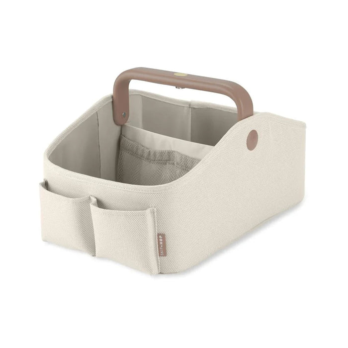 Beige fabric nappy caddy with wooden handle for Toshi Baby nursery, includes button batteries