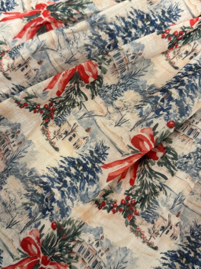 Close-up of snowy Christmas train toile print on The Polar Express dress