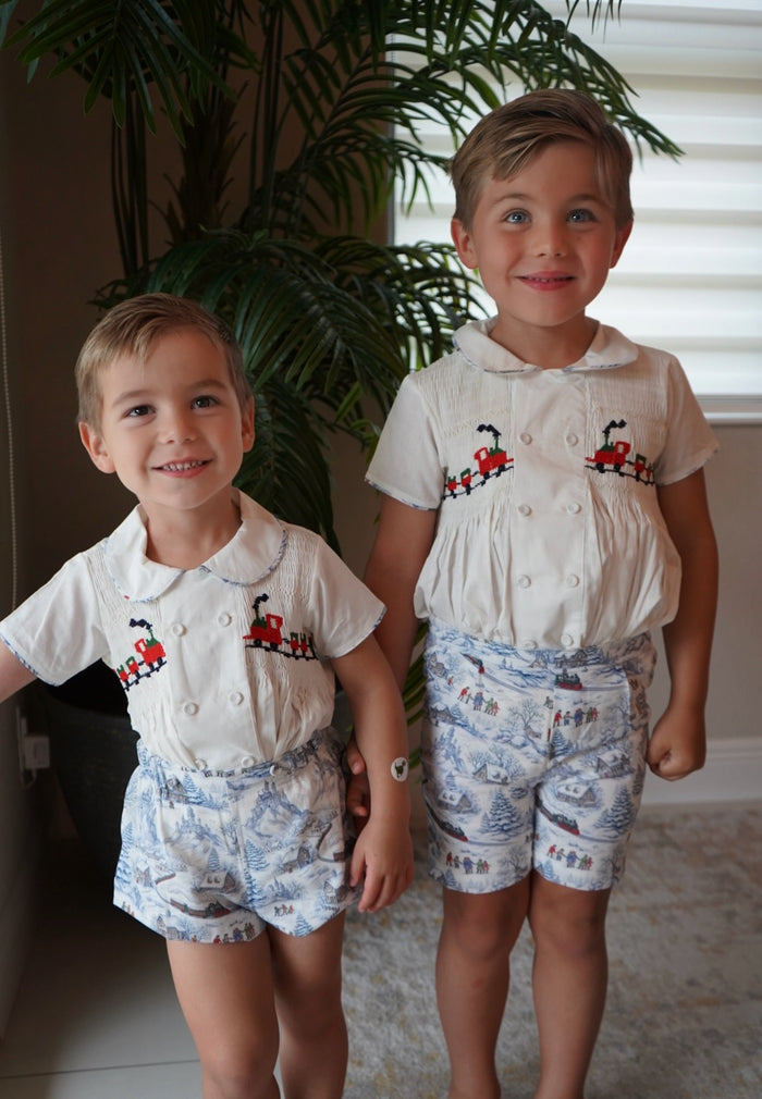 Boys wearing coordinating Polar Express Christmas outfits