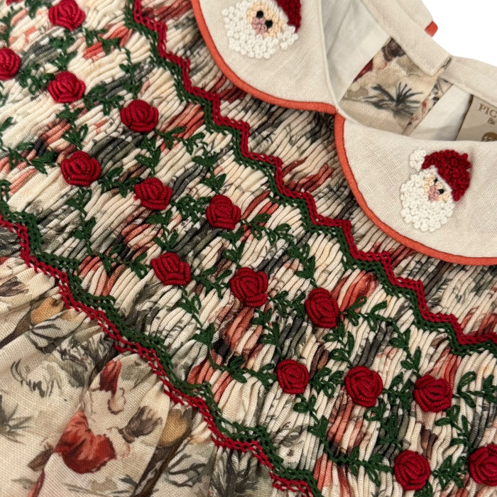Close-up of handsmocking and embroidered Santa collar details on The Santa Claus romper
