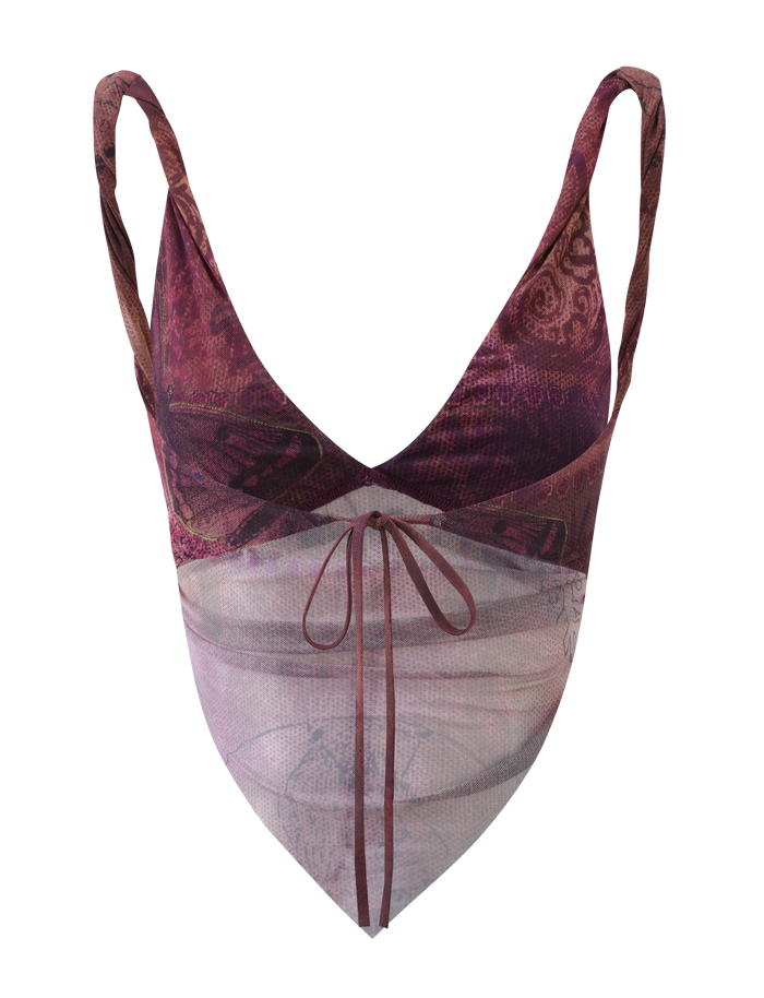 The TIGERMIST THEO TOP - PLUM BUTTERFLY PAISLEY is a sleeveless V-neck crop featuring maroon and purple butterfly paisley print, a sheer light pink panel with a front tie, thin straps, and adjustable back ties for the perfect fit.