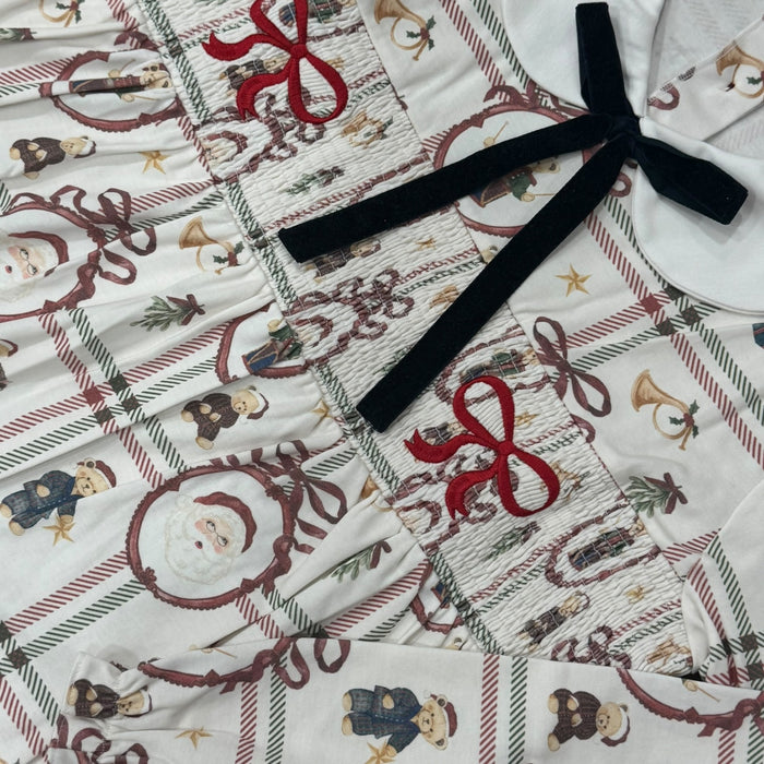 Close-up of Festive Bears Christmas print with black velvet bow detailing