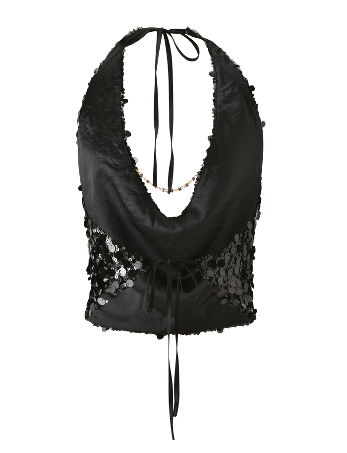 The ZANA TOP by TIGERMIST is a black sequin halter crop top featuring a deep neckline, sheer lace side panels, and a waist tie—an elegant update to the classic style.