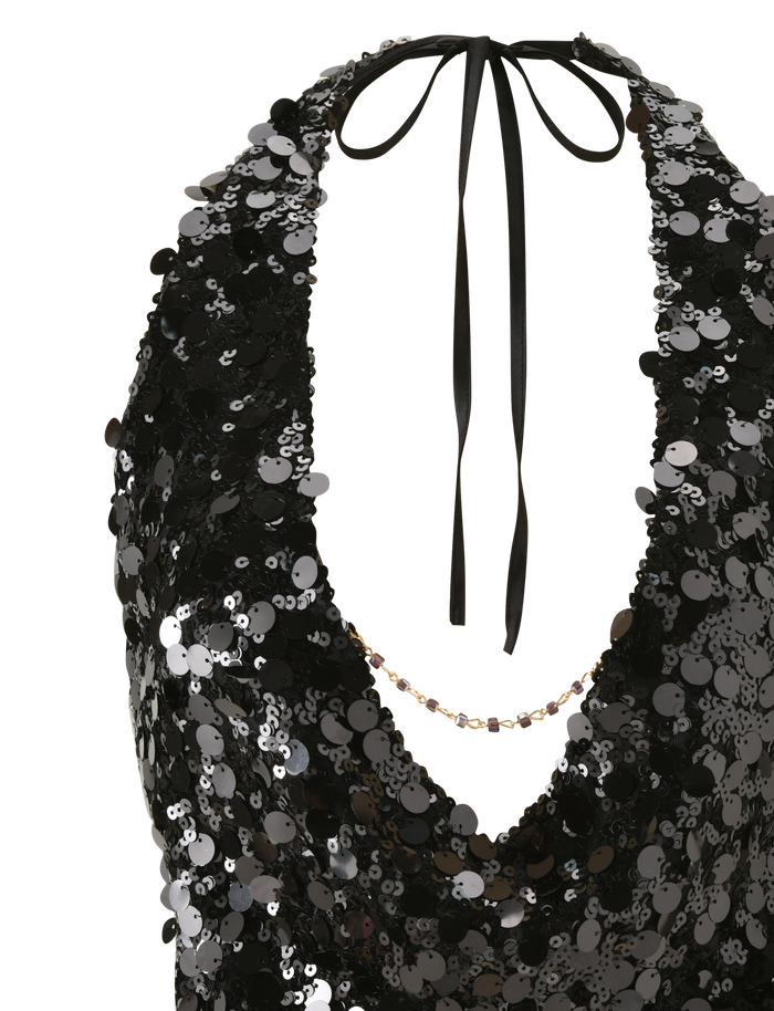 The TIGERMIST ZANA TOP - BLACK SEQUIN is a black halter top with a deep cowl neckline, adorned with shimmering, reflective sequins for a striking look.