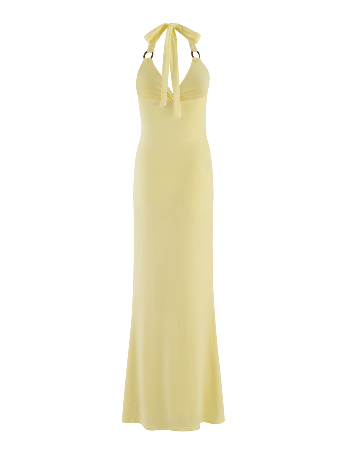 The ZENEVA MAXI DRESS by TIGERMIST in Lemon is a light yellow, sleeveless, floor-length halter dress with a fitted bodice, open back, and wide neck bow in buttery jersey.