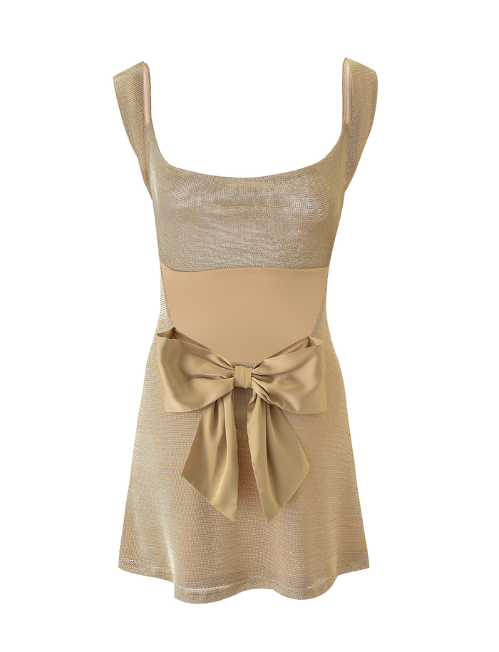 The ZITA MINI DRESS - GOLD by TIGERMIST features a scoop neckline, sheer upper bodice, large satin waist bow, and a fitted top with slightly flared mini skirt for an elegant look.